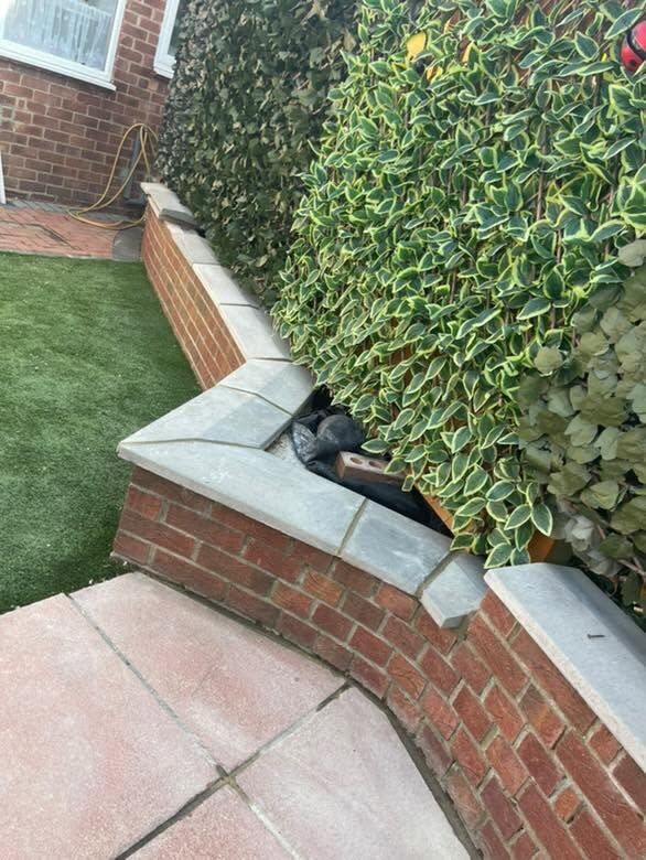 Neatly finished red-brick garden wall with coping stones in Newcastle