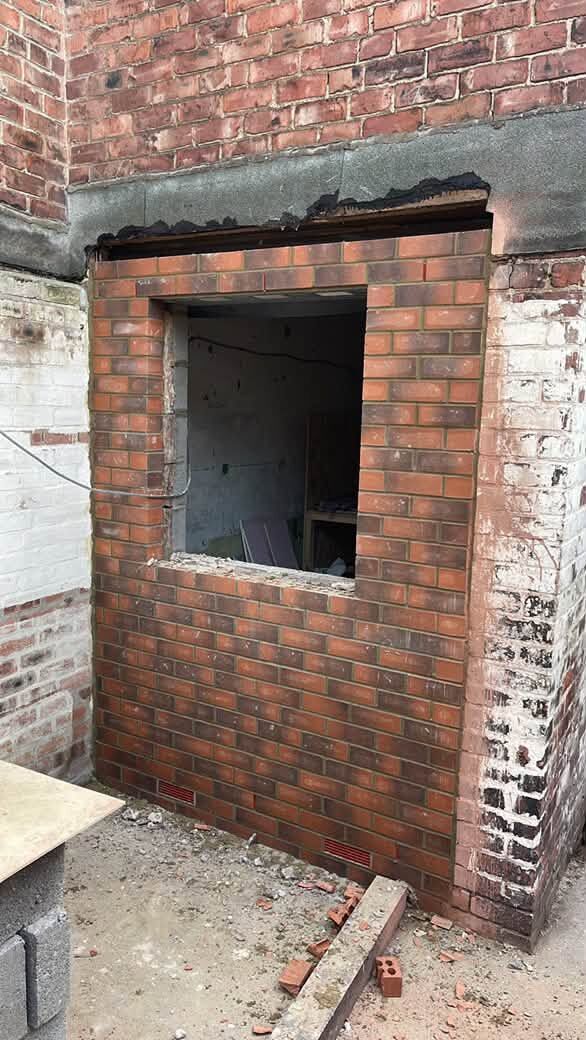 Brickwork built around a new window opening in an existing wall